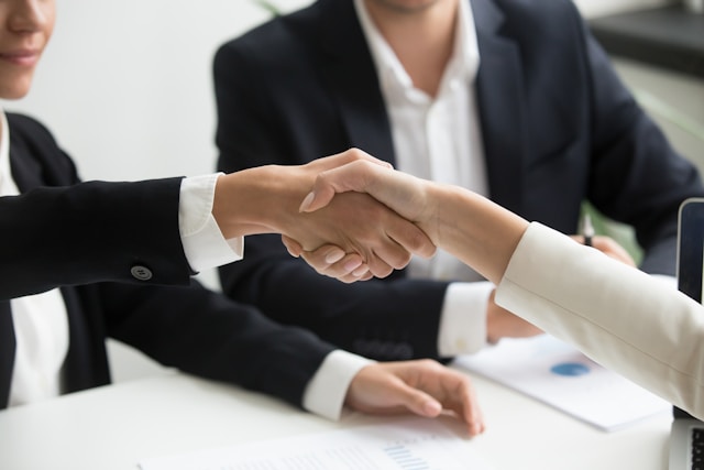 Two people shaking hands
